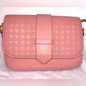 Pink clutch handbag.